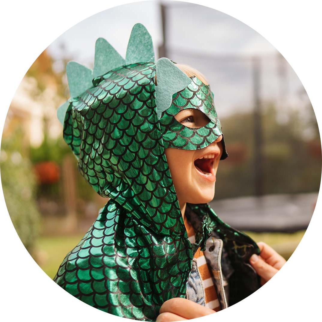 Kid in a dinosaur costume